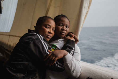 The Ivorian Bintou 42 years old and her daughter Miriam 20 years old hug each other.